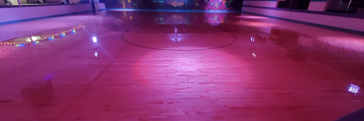 a roller rink with colorful lighting