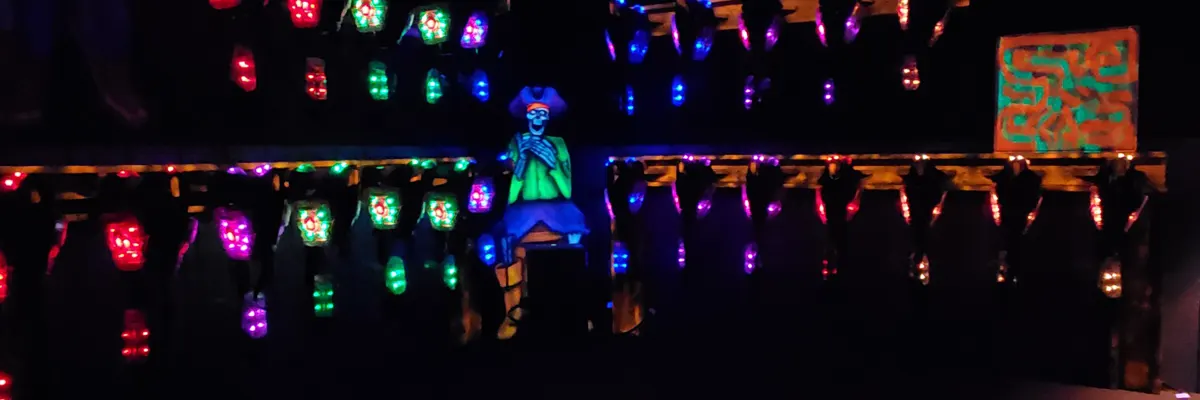 a laser tag arena under black lighting