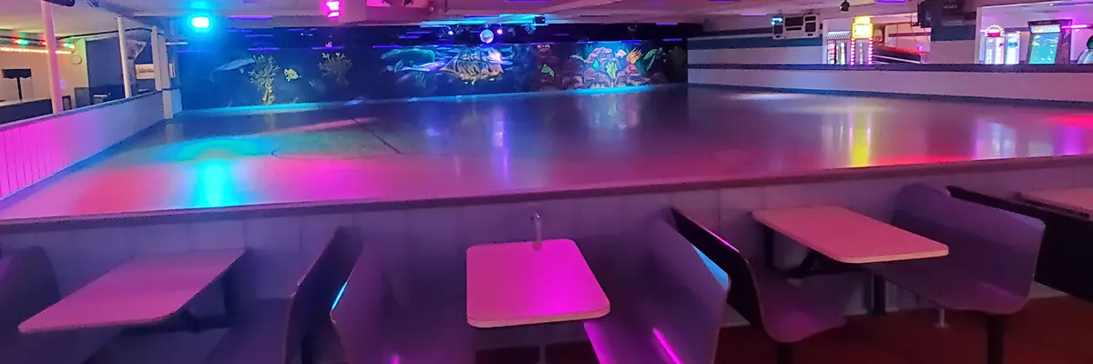 a roller rink with colorful lighting